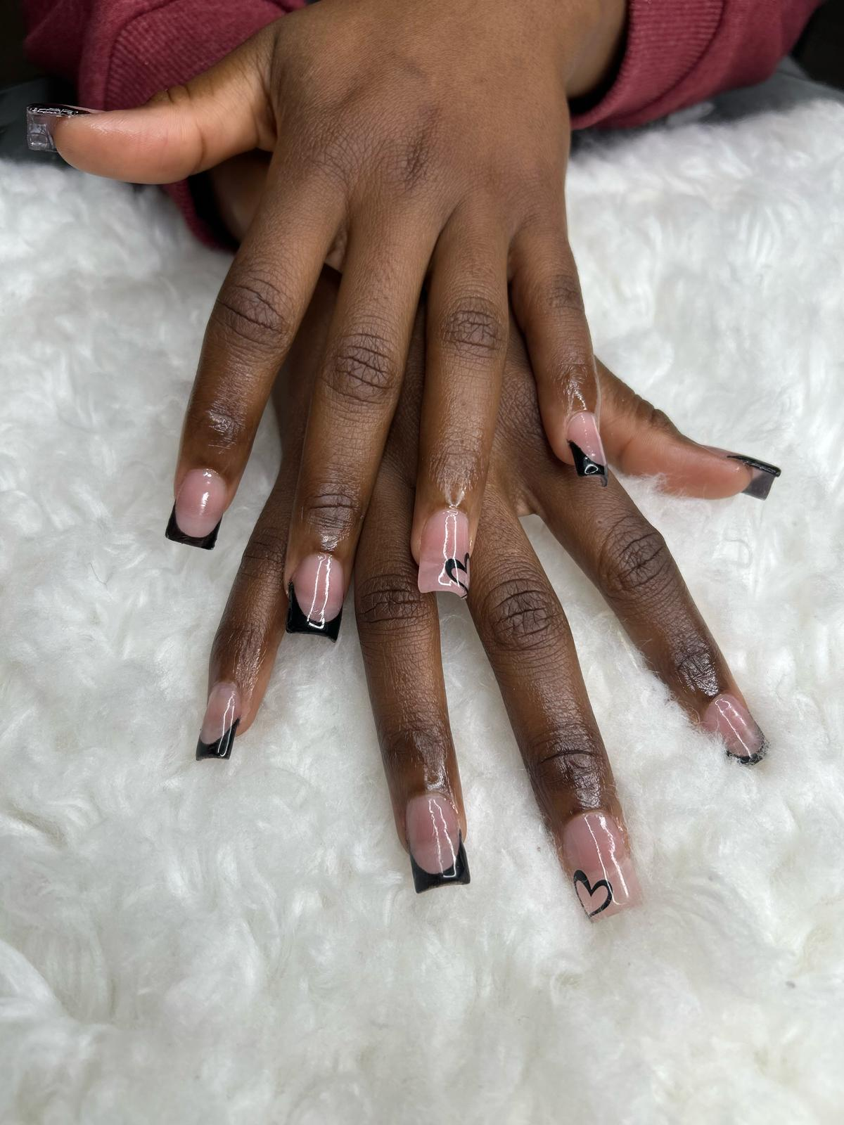 Minimalist black French with subtle hearts.