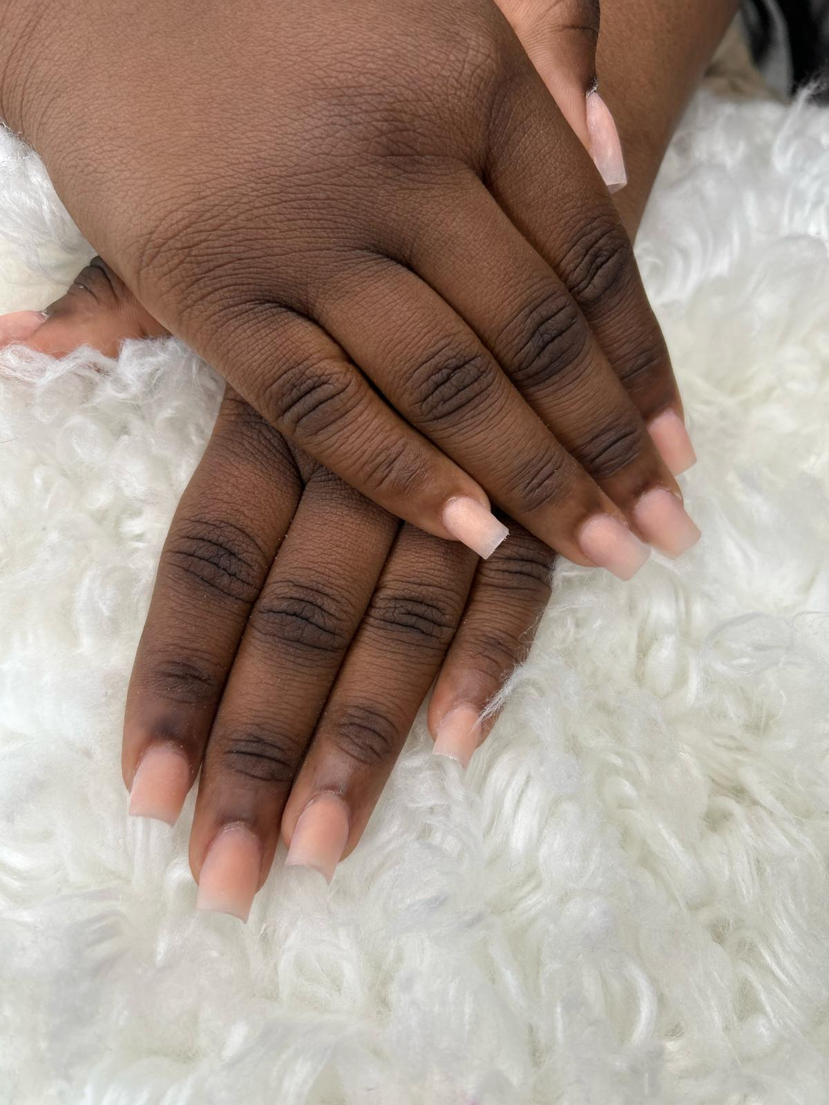 Soft matte nude long square nails — clean and minimal.